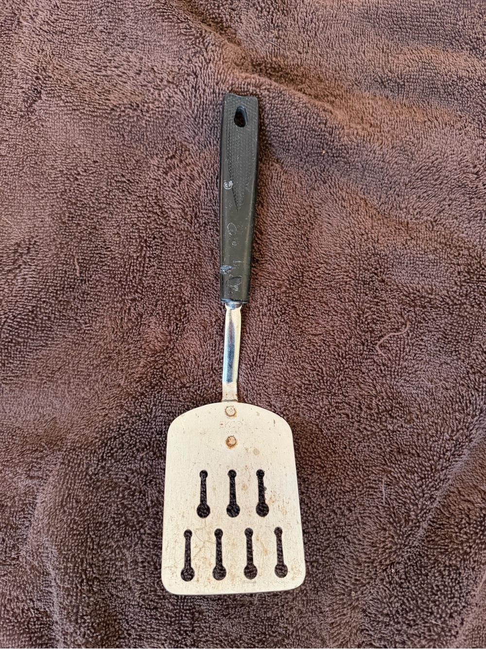 Black and Silver Slotted Metal Turner with Black Handle